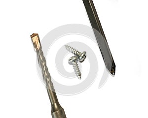 Drill bits with screws and screwdrivers on white background