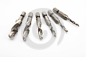 A drill that can be tap for threading in a metal on white background , drilling and threading in 1 process