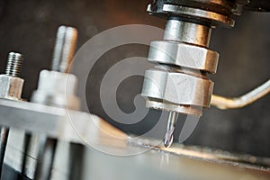 Drill drilling a hole on metalworking machine