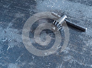 Drill key on scratched metal background