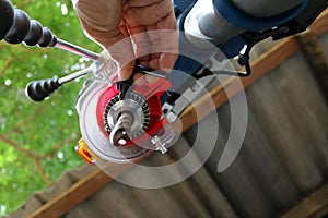 Drill presses machine with machinist.