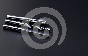 drill and reamer spiral right. Material carbide. Used for metalwork. On dark background