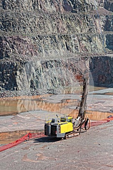 Driller machine in a quarry mine. open pit.