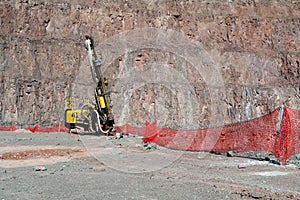 Driller in an open pit mine