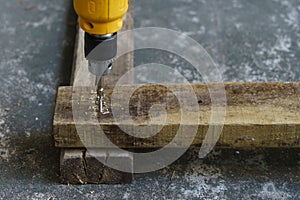 Driller, wood and screw for carpenter`s job