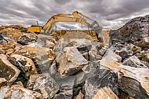 Drilling excavator working in a quarry