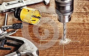 Drilling holes using a manual electric tools