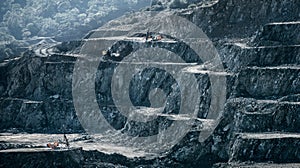 Drilling machines and loader working in diabase quarry