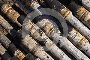 Drilling pipe. Rusty drill pipes were drilled in the well section. Downhole drilling rig. View of the shell of drill pipes and