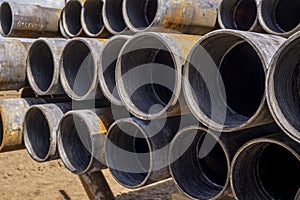 Drilling pipe. Rusty drill pipes were drilled in the well section. Downhole drilling rig. View of the shell of drill pipes and