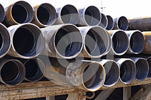 Drilling pipe. Rusty drill pipes were drilled in the well section. Downhole drilling rig. View of the shell of drill pipes and