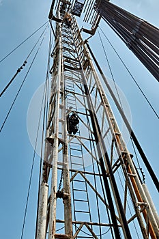 Drilling rig against the blue sky