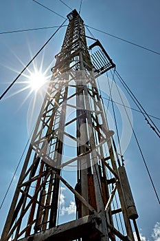 Drilling rig against the blue sky