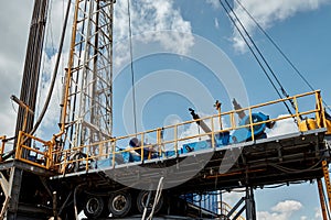 Drilling rig against the blue sky