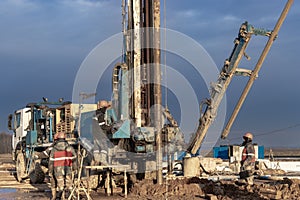 Drilling rig close-up at a construction site. Deep hole drilling. Extraction of minerals oil and gas. Working process
