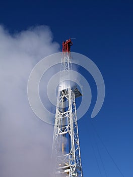 Drilling rig in clouds