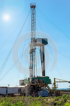 Drilling rig in oil field for drilled into subsurface in order to produced crude.