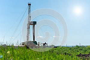 Drilling rig in oil field for drilled into subsurface in order to produced crude.