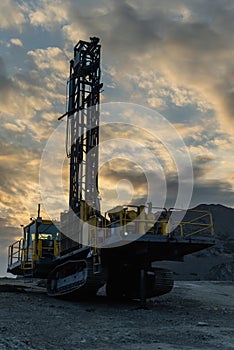 Drilling rig in an open pit.