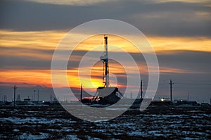 The drilling rig during sunset