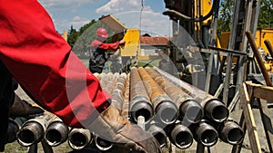 Drilling Rig and Two Oil Workers