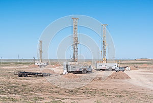 Drilling rigs on the platform of the field.