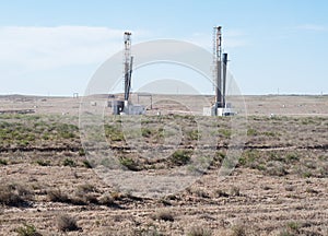 Drilling rigs on the platform of the field.