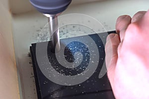 Drilling a workpiece on machine. work on a drilling machine
