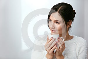 Drink. Beautiful Woman Drinking Tea From Cup