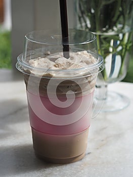 Drink Beverage, iced coffee Cappuccino Smoothie in clear plastic glass put on white marble, space red color for text or logo, take