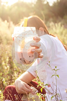 Drink Boba Tea in the grassland, sunset light