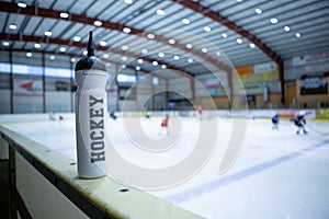 Drink bottle on board ice hockey rink