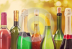 Alcohol drinks bottles on light background