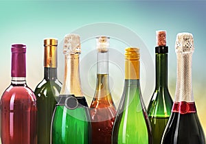 Alcohol drinks bottles on light background