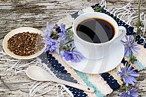 Drink from chicory and blooming chicory photo