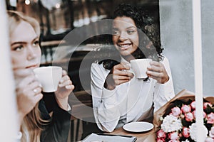 Drink Coffee. Blond Girl. Mulatto. Sit. Cafe.