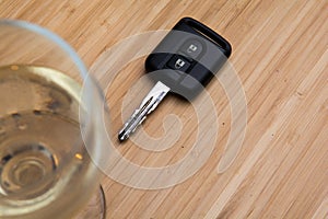 Drink driving, alcoholic drink and car keys on the table