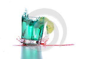 Drink glass with cocktail spills