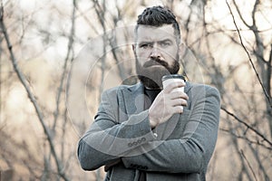 Drink it on the go. Man bearded hipster prefer coffee take away. Businessman drink coffee outdoors. Reloading energy