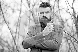 Drink it on the go. Man bearded hipster prefer coffee take away. Businessman drink coffee outdoors. Reloading energy