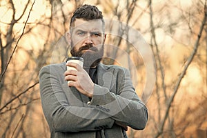 Drink it on the go. Man bearded hipster prefer coffee take away. Businessman drink coffee outdoors. Reloading energy