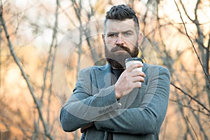 Drink it on the go. Man bearded hipster prefer coffee take away. Businessman drink coffee outdoors. Reloading energy