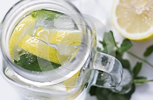 A drink with lemon and mint