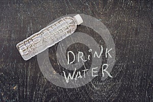 Drink more water - hydration reminder - handwriting on On a chalk board photo