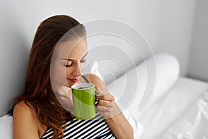 Drink Morning Coffee. Woman Drinking Beverage In Bed. Healthy Lifestyle