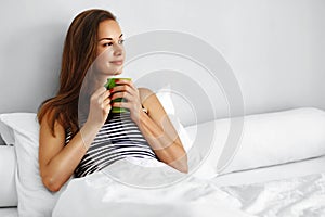 Drink Morning Tea. Woman Drinking Beverage In Bed. Healthy Lifesyle