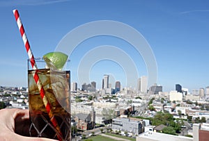 A drink and New Orleans skyline