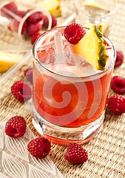 Drink with raspberry, pineapple and peach