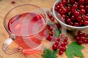 Drink of red currant in a glass Cup