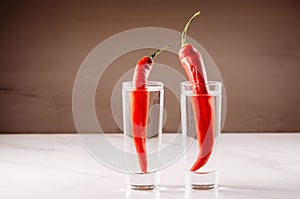 Drink set with two shots of vodka and red pepper/ Drink set with two shots of vodka and red pepper. Selective focus